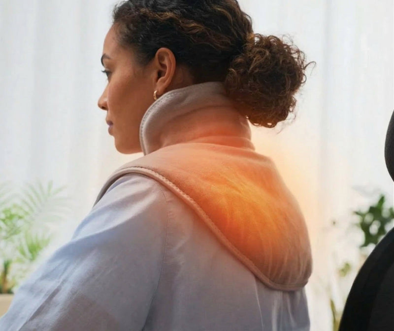 Heated shoulder wrap helping relieve muscle tension and soreness